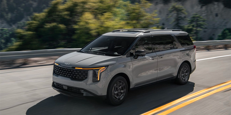 2025 Kia Carnival driving in the hills